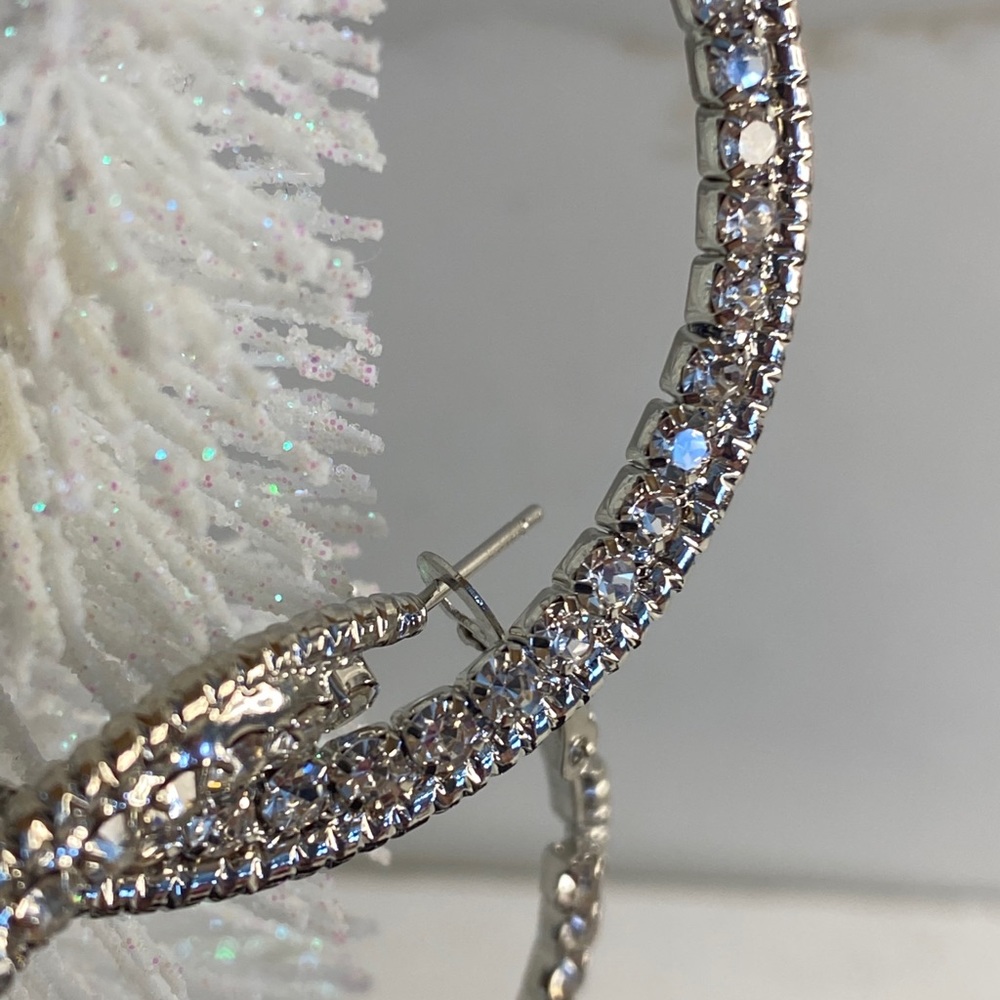 Silver with rhinestone hoop earrings.